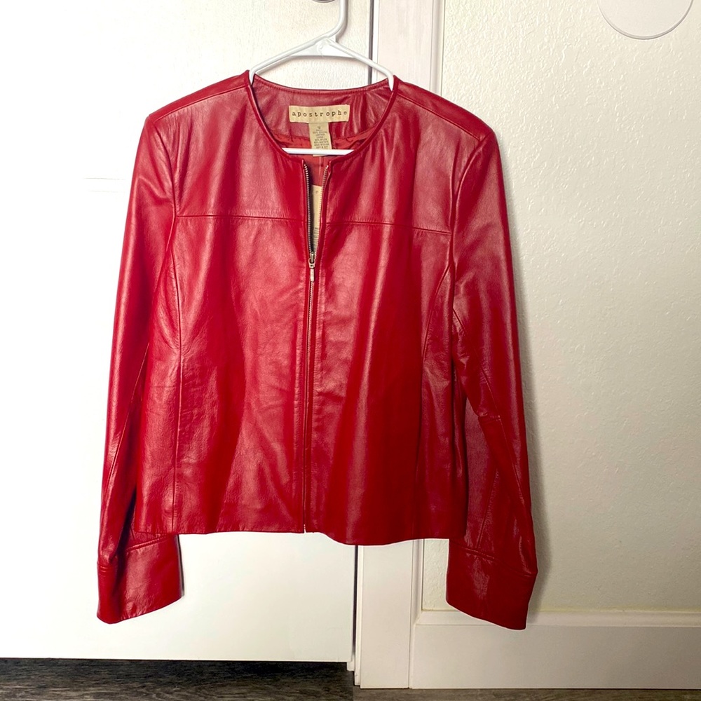 100% leather vintage jacket. Size 12. Deep red, never worn.